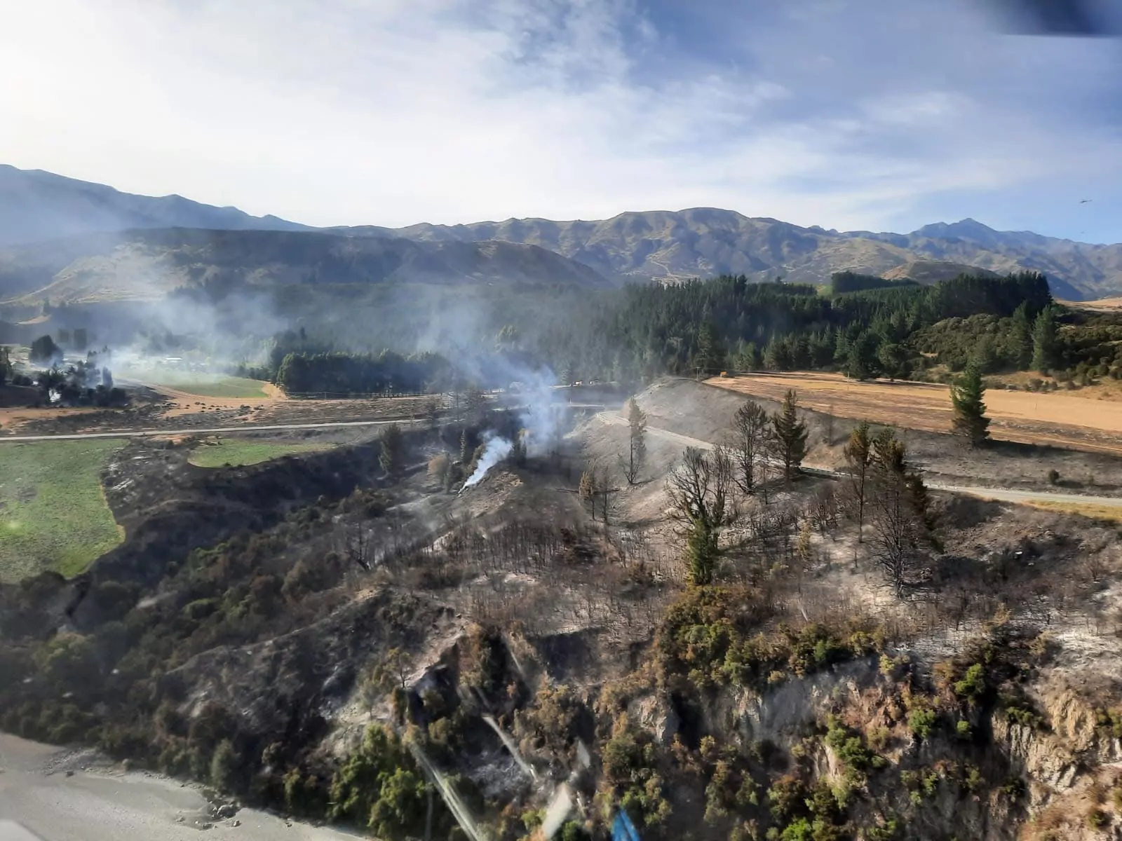 Firefighters contain SH7 vegetation fire as investigation continues