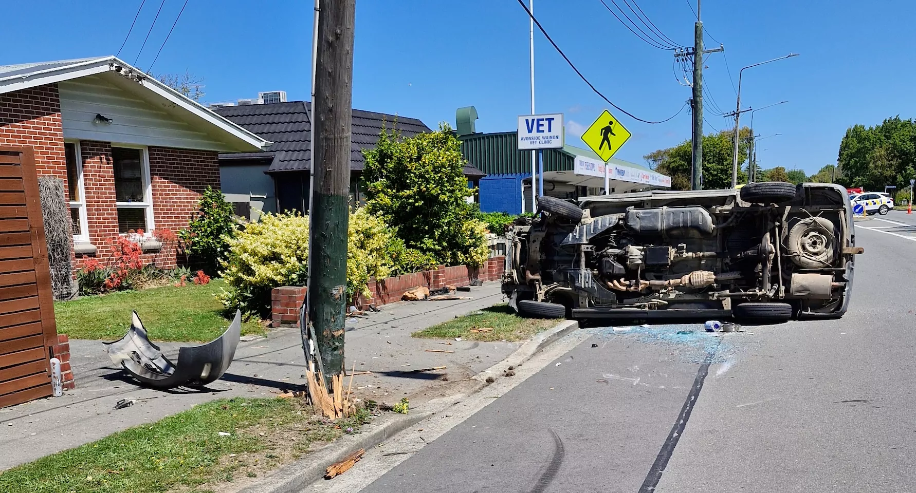 Vehicle flips in Wainoni Road crash, power pole damaged